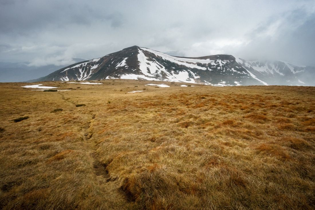 Hole in clouds and mountain of Turkul.